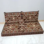 Elegant Majlis seating with handcrafted cushion patterns.
