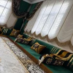 Luxurious green Majlis sofa set with matching patterned cushions