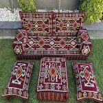 Majlis seating set featuring a sofa, poufs, and backrests.