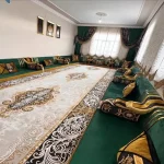 Traditional Majlis seating featuring a bold green and black design.