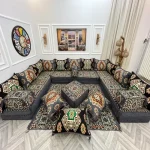 Traditional Majlis sofa set with colorful geometric patterns.