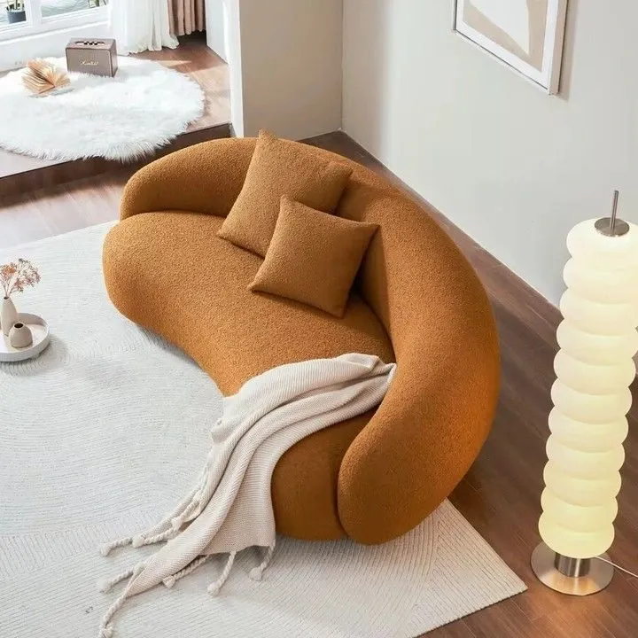 Curved sofa with luxurious fabric upholstery