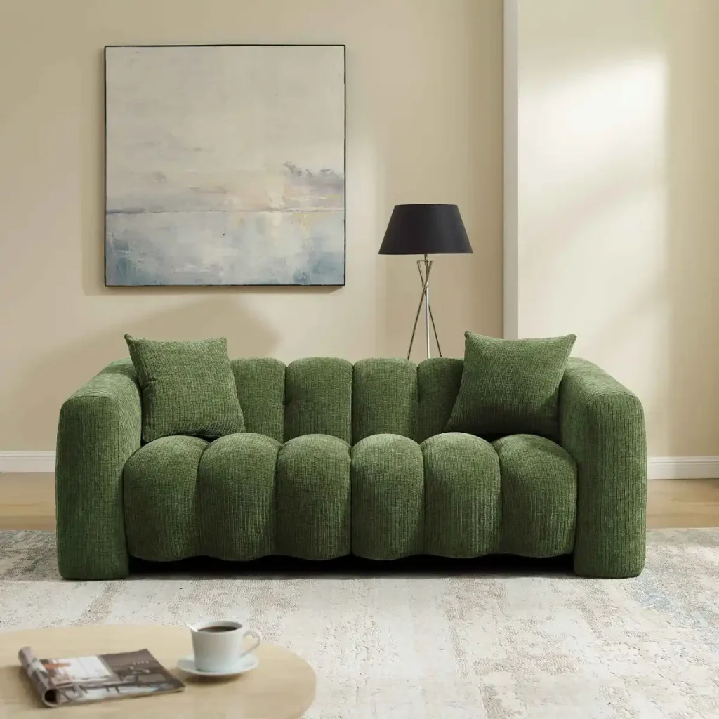 Green modular upholstered sofa with rounded cushions