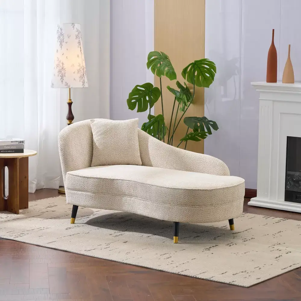 Velvet upholstered curved chaise lounge with lumbar pillow